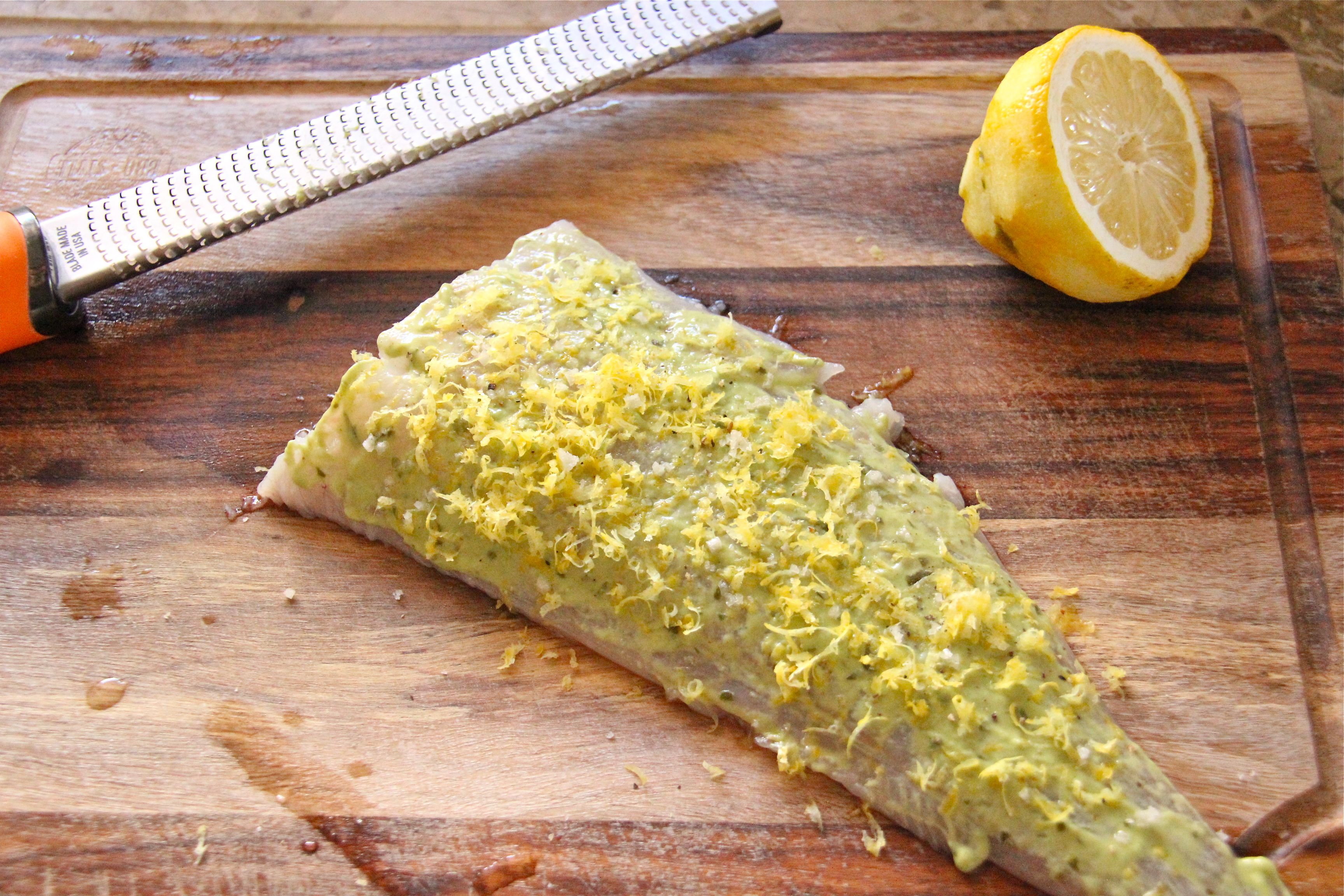 lemon and wholegrain mustard spread on a pollock fillet
